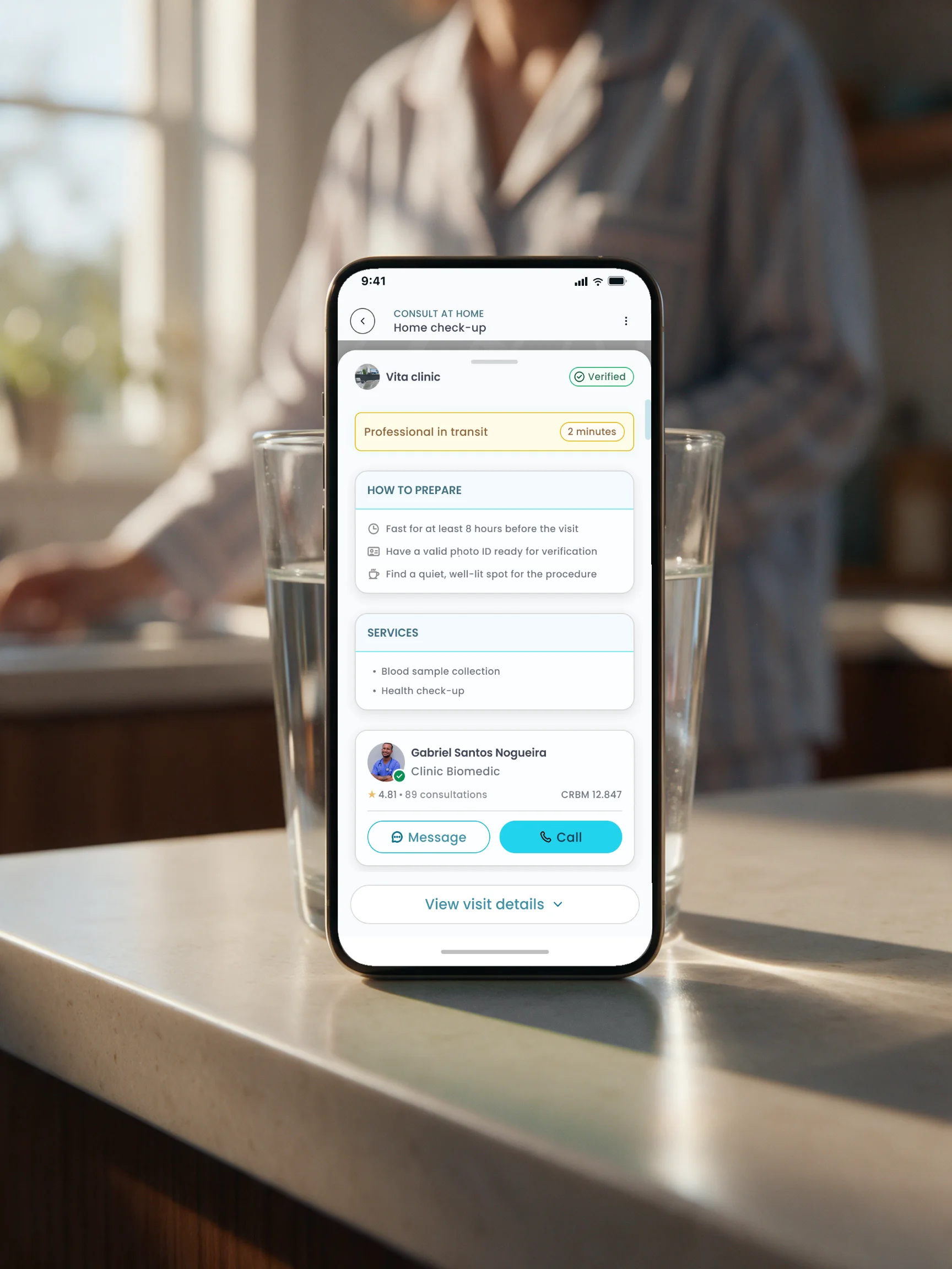 The MedMe app on a kitchen counter showing the professional in transit